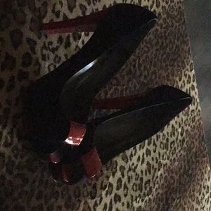 Black suede shoes with red lacquered 5” heels and red clip and red toe